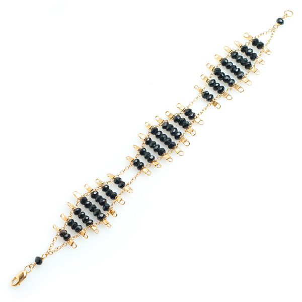 Kellan bracelet featuring rows of faceted Onyx beads, suspended on rows of 14k gold-fill wire and chain, and finished with a lobster clasp.  
