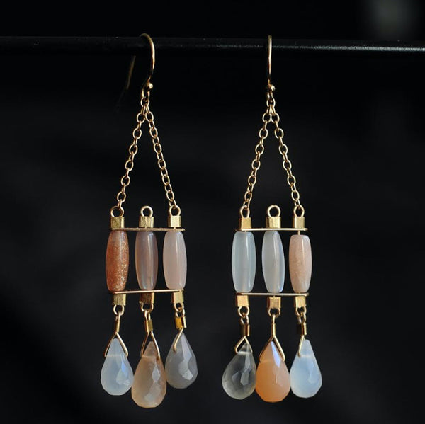 Byzantine style gold chandelier earrings with moonstones in milky white, peach, and smoke.