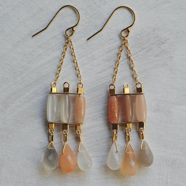 Byzantine style gold chandelier earrings with moonstones in milky white, peach, and smoke.